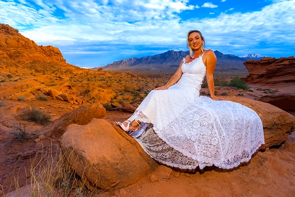 Couple posing for a professional photo session among the red rock formations of Valley of Fire State Park