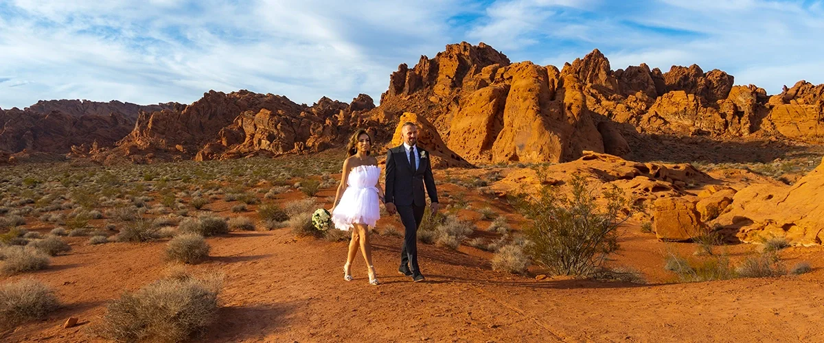 Wedding couple walking at Valley of Fire State Park